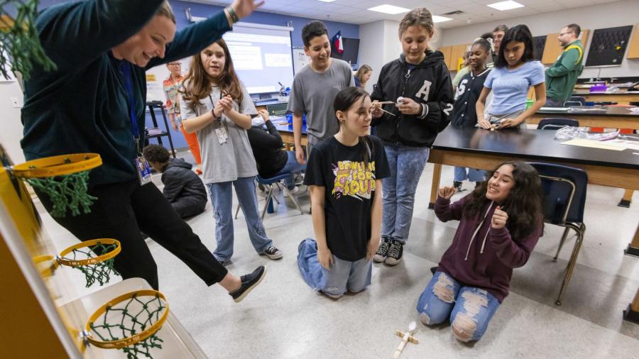 Students at Cesar Chavez Middle School participate in Baylor University's National Engineers Week activities, building their own catapults to practice problem solving and creativity.
