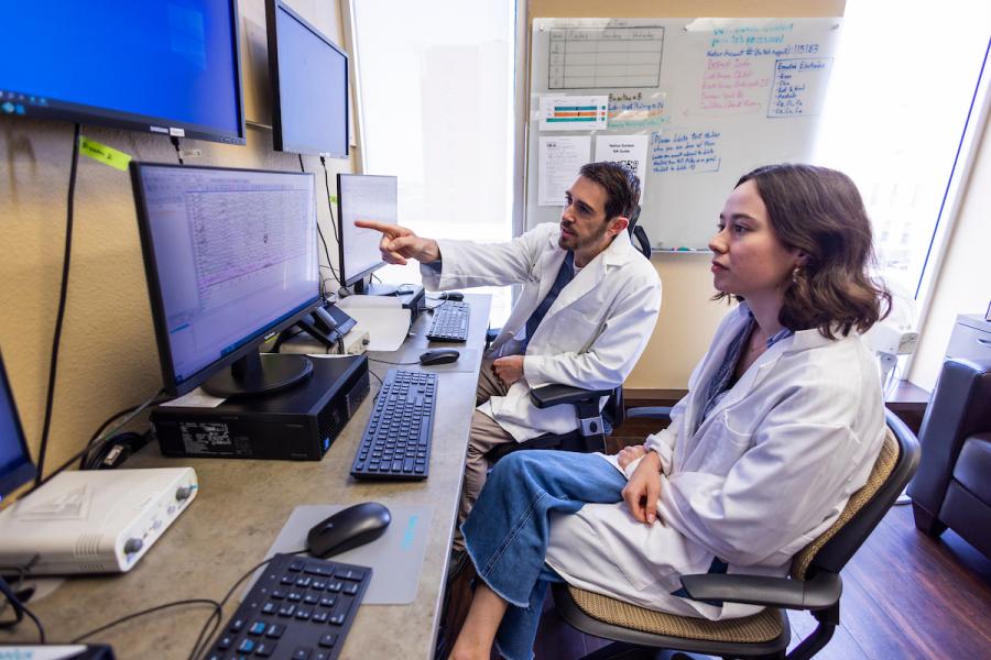 Michael Scullin directs a student in his Baylor laboratory.