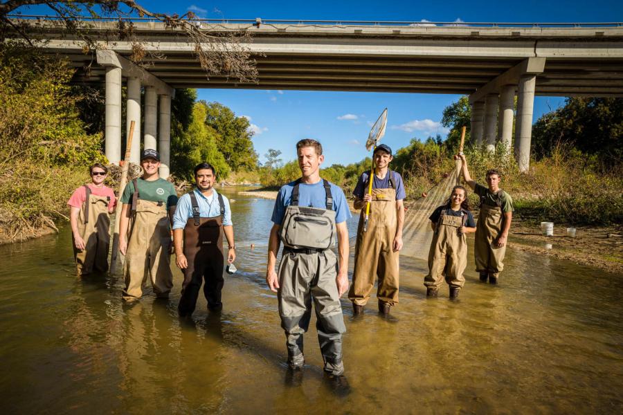 Ryan McManamay and students in Texas creek.