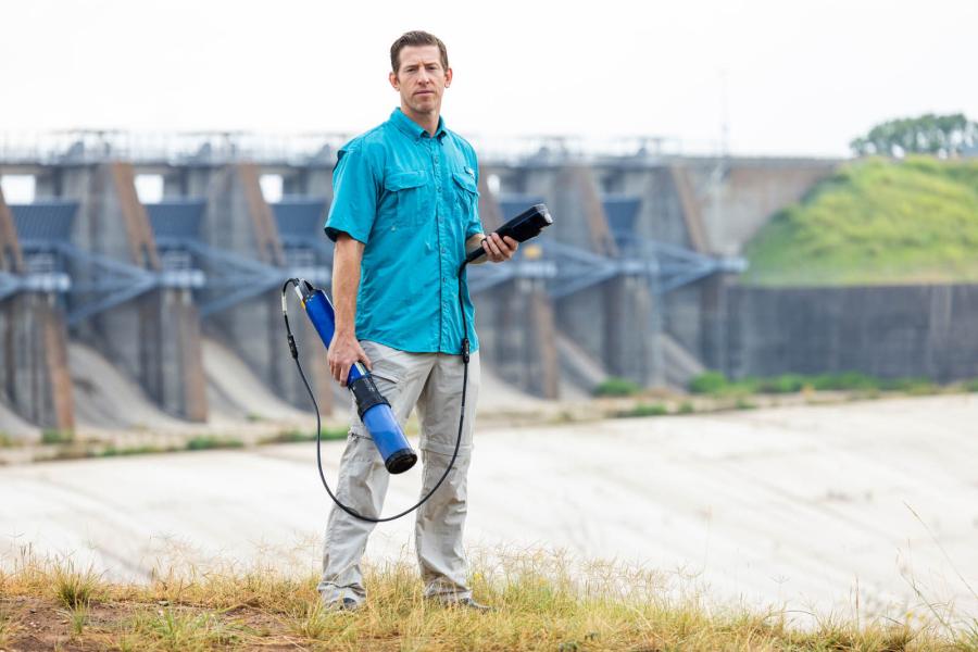 Ryan McManamay conducts research in the Bosque River in Waco.