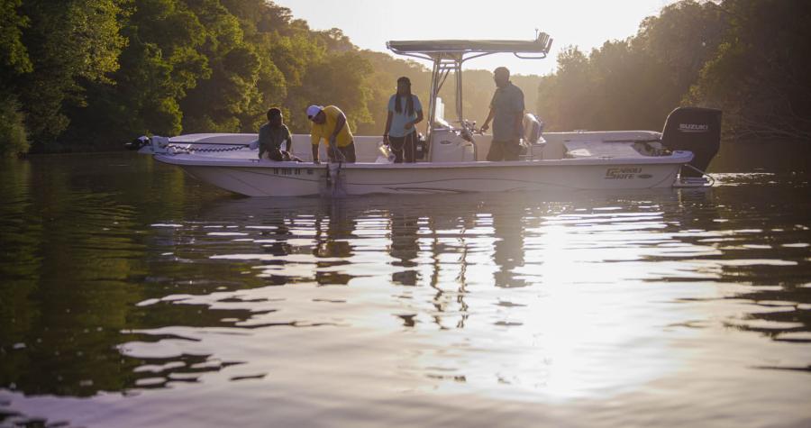 Thad Scott and students conduct water testing on a Texas River.