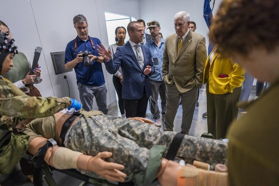ARKTOS co-director and Baylor professor Dr. Cory Smith leads a press tour of an Arctic environmental chamber for Congressman Pete Sessions (TX-17) during the research center's grand opening. 