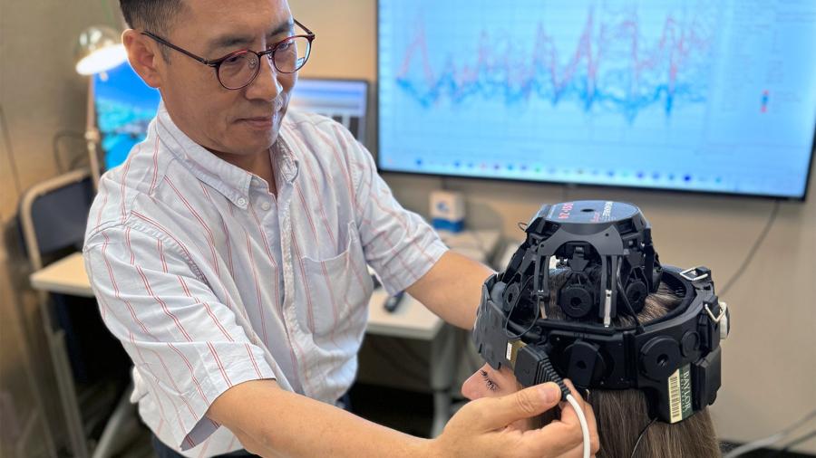 Aphasia researcher Jungjun Park (left) in his lab, the Baylor Adult Neurogenic Disorders and Aging Lab